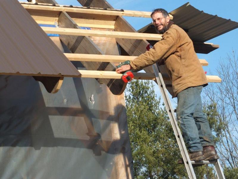 David Stimson builds a roof on his barn on River Road in Boothbay. Stimson said he intends to take his business to Belfast. RYAN LEIGHTON/Boothbay Register